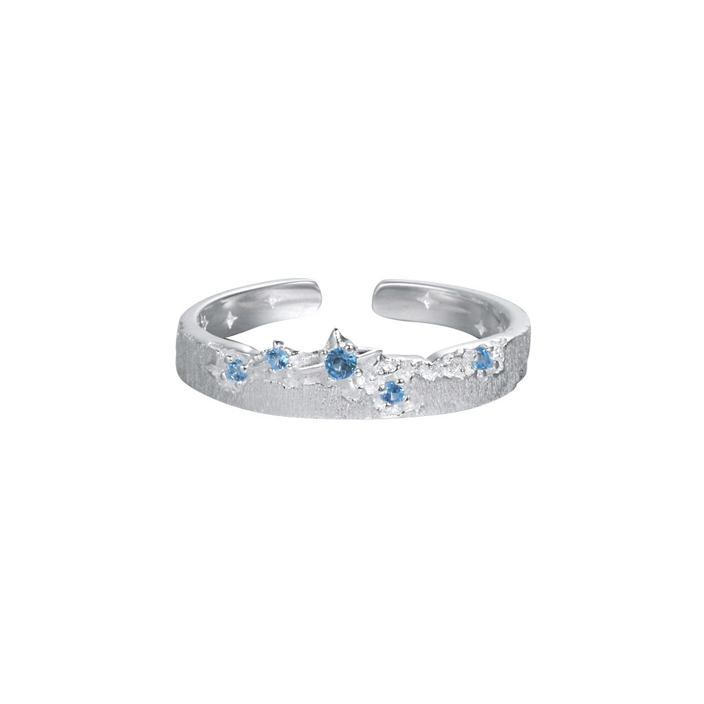 Anillo ajustable de plata de ley 925 con patrón de estrella y textura cepillada, circonia cúbica azul
