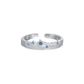 Anillo ajustable de plata de ley 925 con patrón de estrella y textura cepillada, circonia cúbica azul